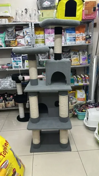 Buy a 5.5 ft Cat Scratching Tree Post with House for your cats. Multi-level cat tower with sisal posts, cozy condo, perches & hanging toys – perfect for play, rest & furniture protection.